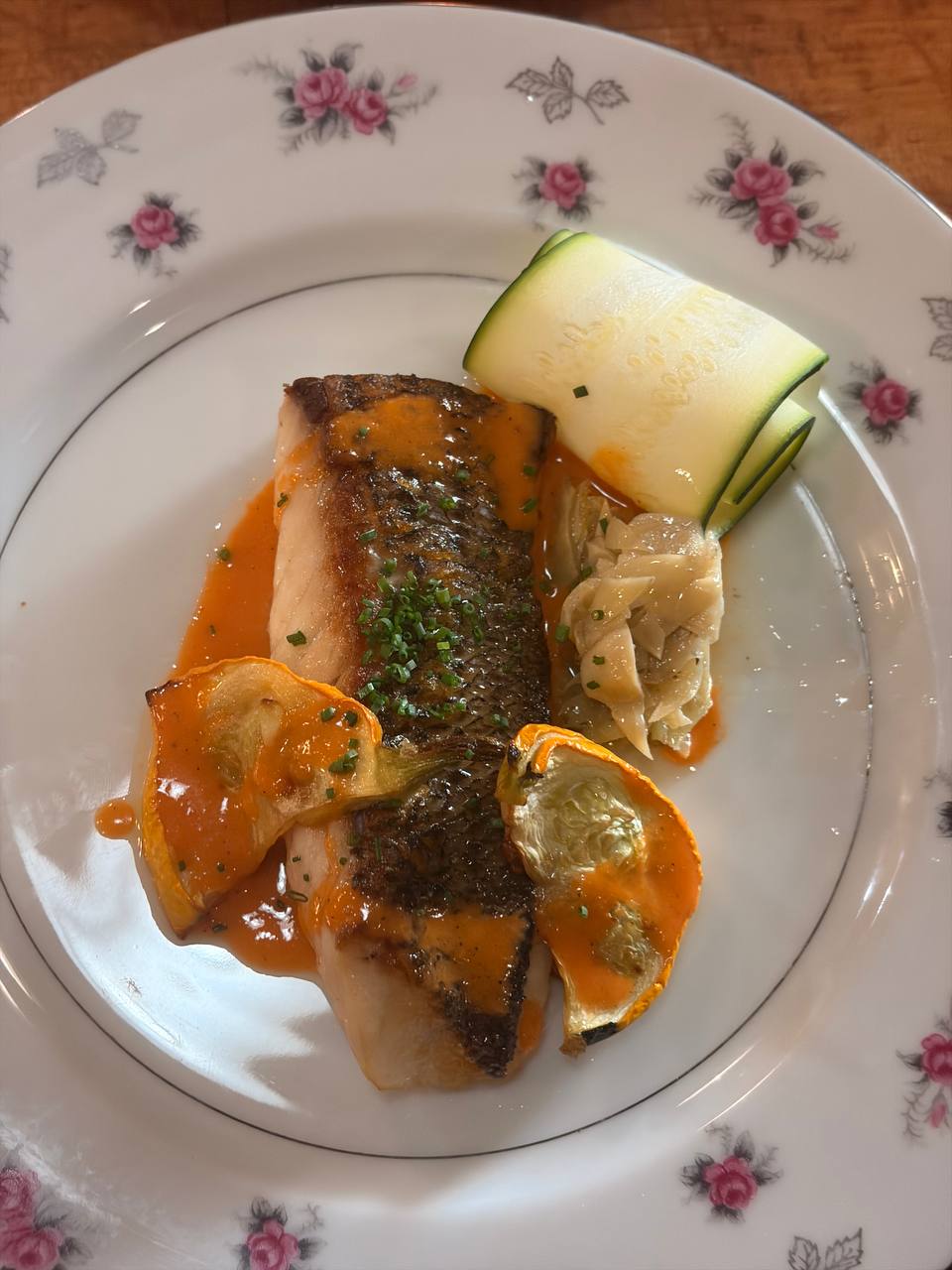 Pan-seared fish with seasonal vegetables