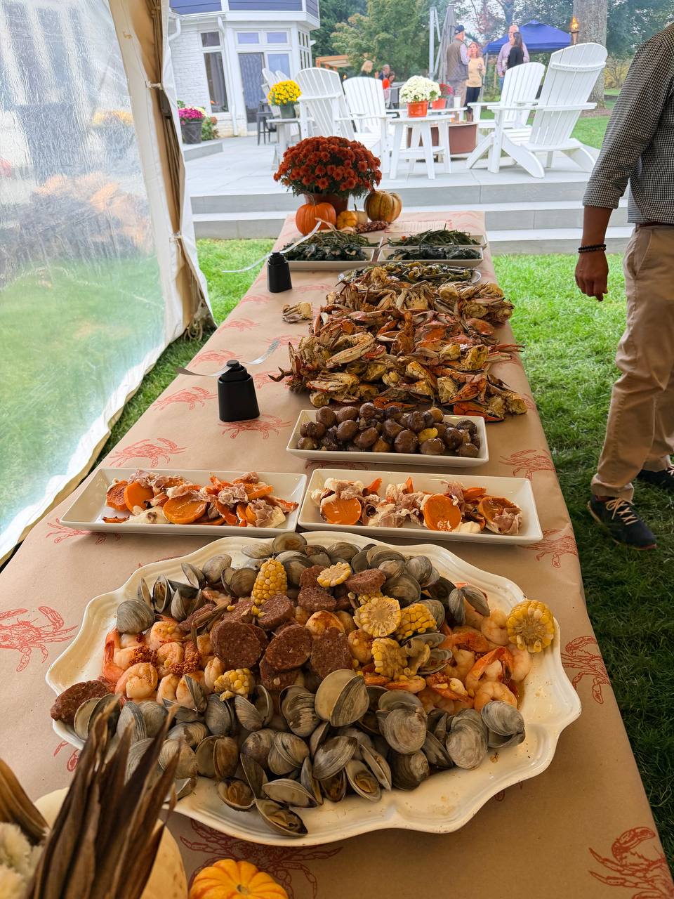 A table set with seafood and seasonal dishes